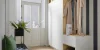 Ein stilvoll eingerichteter Eingangsbereich mit Garderobe, Sitzbank und Dekoration, passend für Nolte Living.