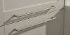 A kitchen cabinet with elegant, gold-colored handles. Nolte Küchen.