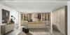 Una cocina moderna y elegante con isla central y armarios beige, diseñada por Nolte Cocina.
