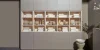 Ein Regal mit dekorativen Vasen und Büchern in einem modernen Design, präsentiert von Nolte Living.