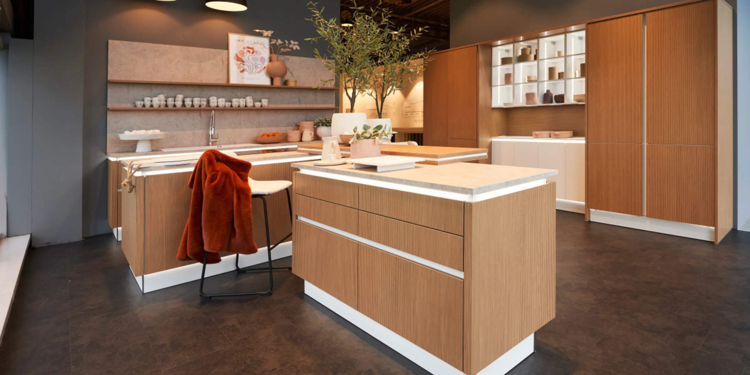 A modern kitchen with a wood look and island presented by Express Küchen.