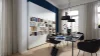 Ein modernes Wohnzimmer mit einem eleganten Bücherregal, Tisch und Stühlen, passend zu Nolte Living.