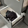 Ein geöffneter Schubladenschrank mit Wäschekörben in einem Hauswirtschaftsraum von Nolte Hauswirtschaftsräume.