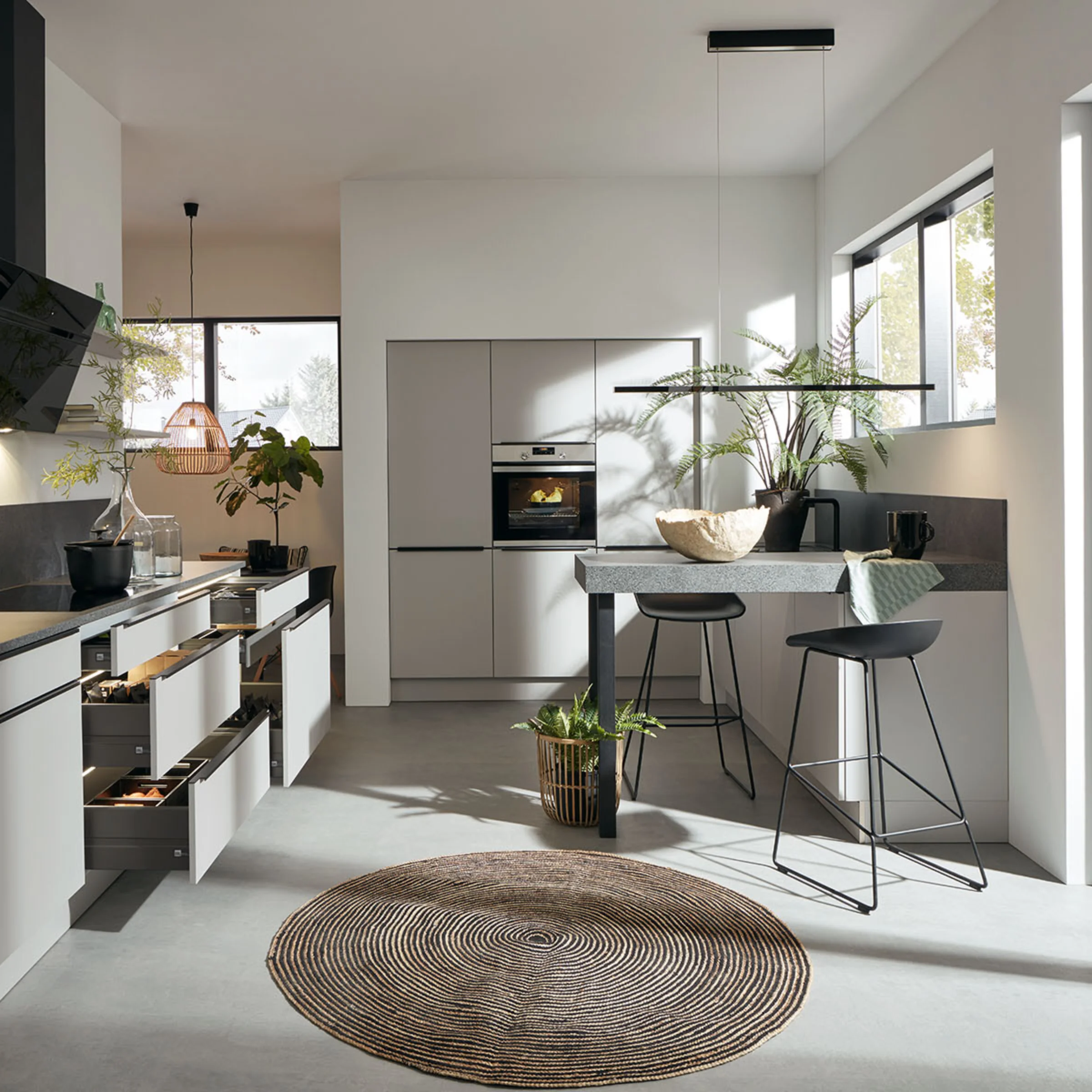 Nolte Kitchen: Modern kitchen with sleek cabinets, open shelves, and large windows providing ample natural light.