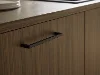 Wooden kitchen drawer front with modern handle. Nolte Kitchens.