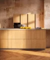 Eine moderne Küche mit Holzfronten und einer Obstschale, Nolte Küchen.