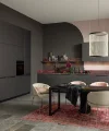 Elegante Küche mit dunklen Schränken und modernem Esstisch. Nolte Küchen.