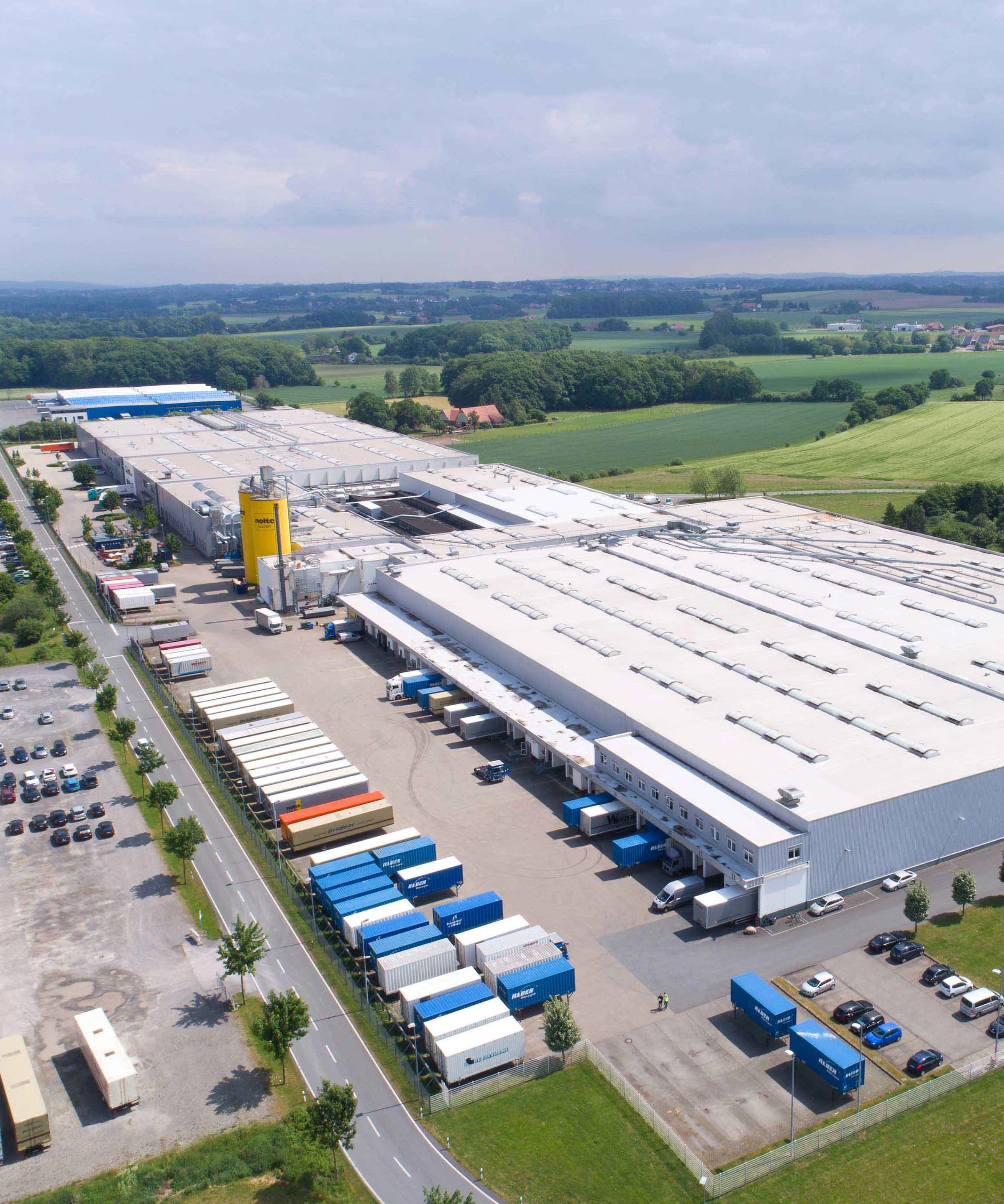 A large industrial hall in a rural setting, Nolte Kitchens.